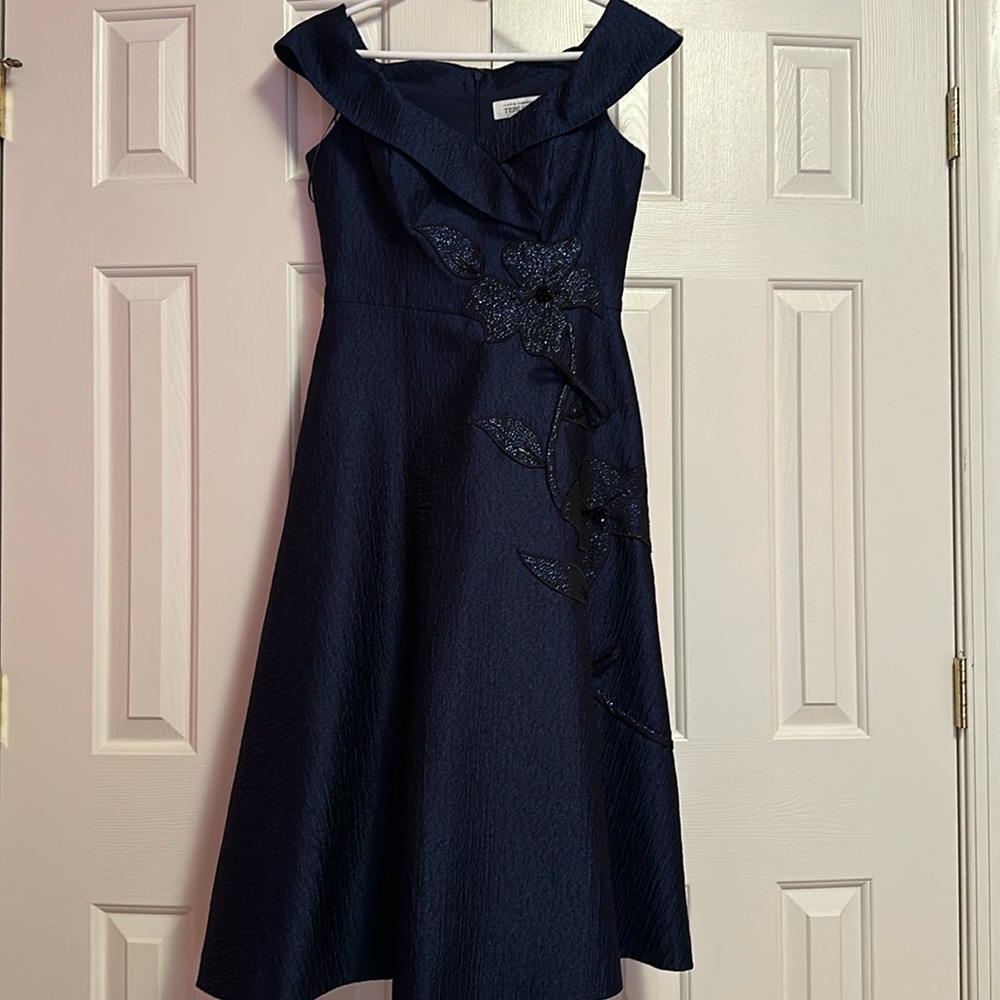Brand New with all the tags. Bought from Neiman Marcus.Color dark blue/navy.